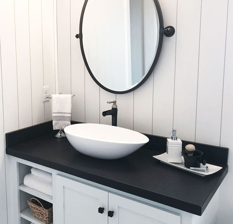 Bathroom-Countertop Dark cabinet tops in a bathroom