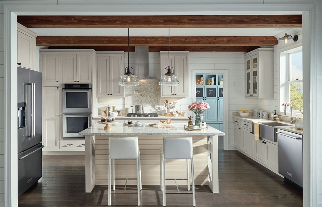 Cream colored kitchen with wood floor
